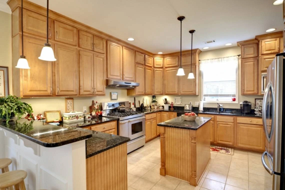 KITCHEN REMODELING · WOOD CABINETRY & ISLAND